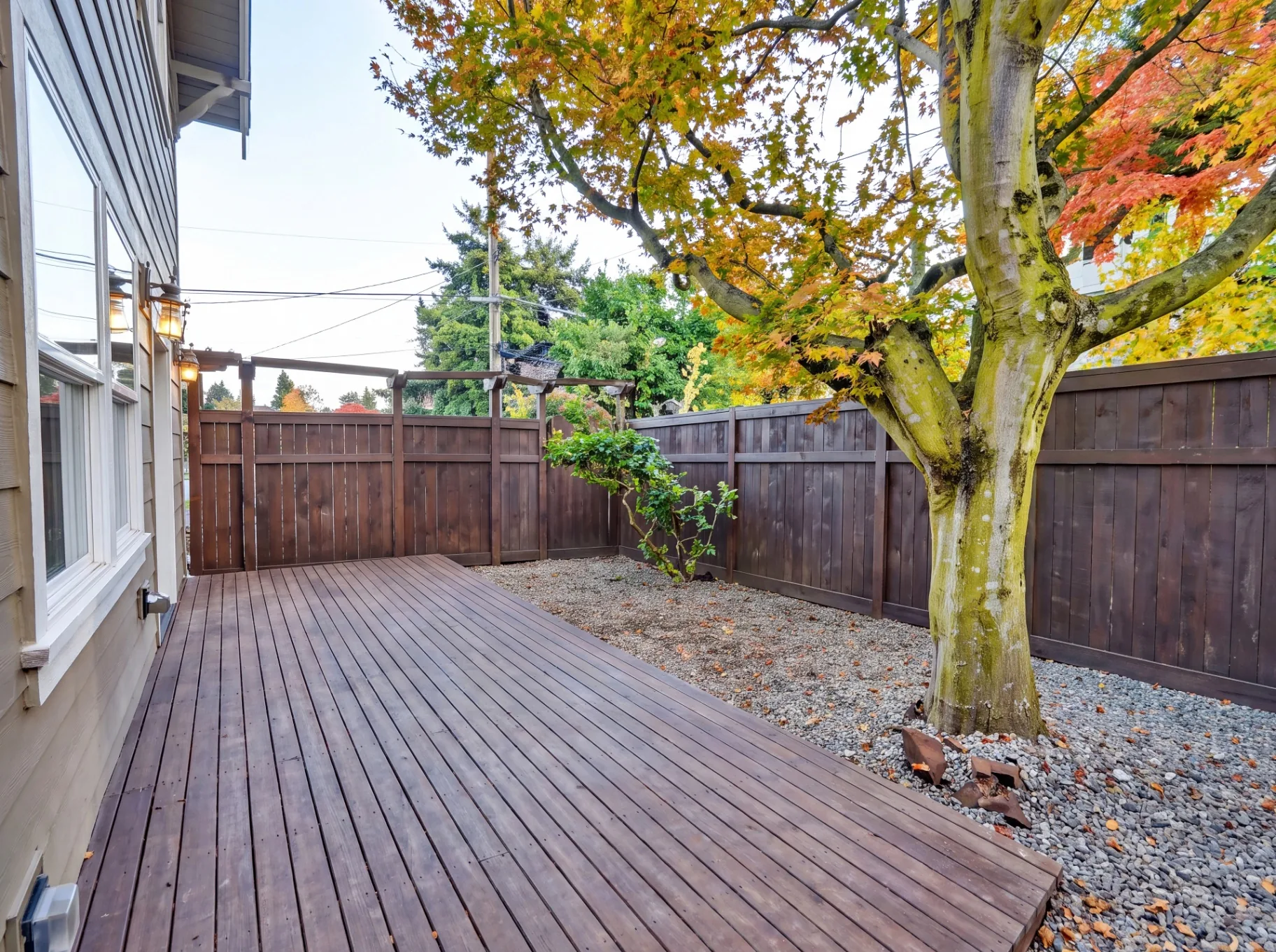 Cedar deck with pergola and landscaped backyard
